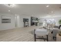 Open-concept living space with a kitchen, dining area, and modern furnishings at 1323 W Tuckey Ln, Phoenix, AZ 85013