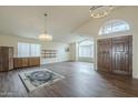 Spacious dining area with hardwood floors and a chandelier at 14426 W Morning Star Trl, Surprise, AZ 85374