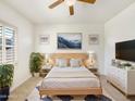 Bright main bedroom with a neutral palette and large windows offering lots of natural light at 10559 E Simone Ave, Mesa, AZ 85212