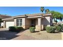 Charming single-story home featuring a well-kept front yard and a cozy, covered entryway at 13613 W Cypress St, Goodyear, AZ 85395