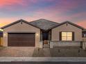 Inviting single-story home featuring a two-car garage, covered entry, and gated front yard at 17648 W Pierson St, Goodyear, AZ 85395
