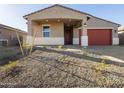 Well-maintained home featuring desert landscaping, enhancing curb appeal with natural beauty at 17743 W Elm St, Goodyear, AZ 85395