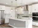 Modern kitchen with stainless steel appliances and a spacious island at 17749 W Elm St, Goodyear, AZ 85395