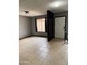 The entryway features neutral tile flooring and a bright white front door with a modern lock at 815 W Kiva Ave, Mesa, AZ 85210