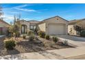 Charming curb appeal with drought-tolerant landscaping and a welcoming entryway at 369 W Glacier Bay Dr, San Tan Valley, AZ 85140