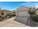Well-maintained home with a spacious driveway and attractive landscaping at 369 W Glacier Bay Dr, San Tan Valley, AZ 85140