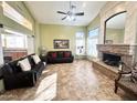 Spacious living room featuring a fireplace and ample natural light at 5431 E Shea Blvd, Scottsdale, AZ 85254