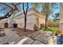 Landscaped backyard with stone pathway and storage building at 6002 N 5Th Pl, Phoenix, AZ 85012