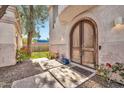 Elegant arched front door entryway with landscaping at 6002 N 5Th Pl, Phoenix, AZ 85012