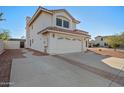 Two-story house with a two-car garage and side yard access at 1705 E Windsong Dr, Phoenix, AZ 85048