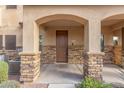 Home's entrance with stone accents and a double door at 2821 S Skyline Dr # 123, Mesa, AZ 85212
