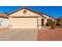 Tan house with a beige garage door and small front yard at 3150 W Foothill Dr, Phoenix, AZ 85027