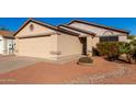 Tan house with a beige garage door and small front yard at 3150 W Foothill Dr, Phoenix, AZ 85027