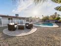 Resort-style backyard features a sparkling pool, patio seating, and lush landscaping at 2804 W Curry St, Chandler, AZ 85224