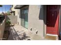 Inviting red front door with a 'Welcome' mat, complemented by a well-kept patio area at 1406 W Main St # 140, Mesa, AZ 85201