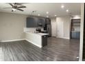 Stylish kitchen with gray cabinets, stainless steel appliances, and an open layout at 1406 W Main St # 140, Mesa, AZ 85201