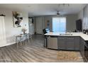 Bright living space with modern decor, dining area, and gray cabinetry at 1406 W Main St # 140, Mesa, AZ 85201