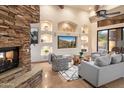 Open living space with a built-in entertainment center and fireplace at 7624 E Stagecoach Pass, Carefree, AZ 85377