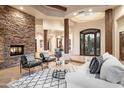 Spacious living area featuring a stone fireplace and high ceilings at 7624 E Stagecoach Pass, Carefree, AZ 85377