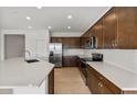 Modern kitchen with stainless steel appliances and an island at 17869 W Getty Dr, Goodyear, AZ 85338