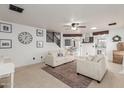 Bright living room with two sofas, a rug and a view of the kitchen at 2985 W Goldmine Mountain Dr, San Tan Valley, AZ 85144