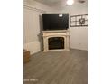 Cozy living room with decorative fireplace and tile flooring at 15 W Mill Reef Dr, San Tan Valley, AZ 85143