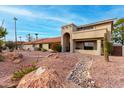 Two-story stucco home with desert landscaping and a gated entry at 15912 E Palomino Blvd, Fountain Hills, AZ 85268