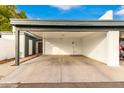 Covered carport with space for one car and additional storage at 4920 E Edgemont Ave, Phoenix, AZ 85008