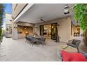 Outdoor patio with seating area, built-in grill, and heaters at 5250 E Deer Valley Dr # 153, Phoenix, AZ 85054