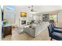 Comfortable living room with fireplace and large windows at 6713 E Paradise Ln, Scottsdale, AZ 85254