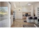 Kitchen with light wood cabinets and a breakfast bar at 3055 N Red Mountain Mtn # 95, Mesa, AZ 85207