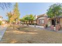 Complex of brick homes with a grassy area at 170 E Guadalupe Rd # 14, Gilbert, AZ 85234