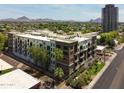 Attractive four-story apartment with brick accents, balconies, and mountain views at 914 E Osborn Rd # 202, Phoenix, AZ 85014