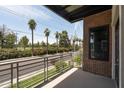 Balcony view overlooking palm trees and landscaping at 914 E Osborn Rd # 202, Phoenix, AZ 85014