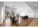 Bright, open-concept living and dining room with a fireplace and balcony access at 17 W Vernon Ave # 316, Phoenix, AZ 85003