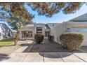 Well-maintained house with walkway and landscaping at 19615 N 140Th Ave, Sun City West, AZ 85375