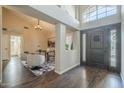 Inviting entryway featuring dark wood floors, high ceilings, and an abundance of natural light at 11085 E Becker E Ln, Scottsdale, AZ 85259