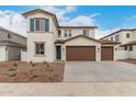 Charming two-story home featuring a terracotta roof, stucco siding, blue shutters, and a spacious three-car garage at 4924 W Beryl Ave, Glendale, AZ 85302