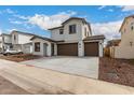 Wide angle view of a modern two-story home with neutral colors and a spacious driveway at 4925 W Beryl Ave, Glendale, AZ 85302
