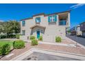 Two-story house with teal front door and well-manicured lawn at 4718 E Thunderheart Trl # 103, Gilbert, AZ 85297