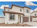 Charming two-story home with neutral colors, a three-car garage, and manicured landscaping at 4918 W Beryl Ave, Glendale, AZ 85302