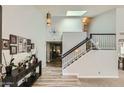 Spacious entry with a staircase and light-filled interior at 6444 E Paradise Ln, Scottsdale, AZ 85254