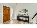 Bright entryway with wood floors and a console table at 6444 E Paradise Ln, Scottsdale, AZ 85254