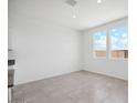 Sunlit dining room with tile floors and large windows showing blue sky views at 1551 E Mason Dr, Casa Grande, AZ 85122