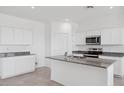 Bright kitchen featuring stainless steel appliances, granite countertops, and white cabinets at 1551 E Mason Dr, Casa Grande, AZ 85122