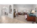 Bright and airy living room with leather furniture and a large window at 19822 N Zion Dr, Sun City West, AZ 85375