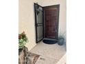 Inviting front entrance with a wood door and security screen at 8849 S 48Th St # 2, Phoenix, AZ 85044