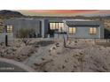 Modern desert home with stone walkway and drought-tolerant landscaping at 12808 E Harper Dr, Scottsdale, AZ 85255