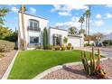 Beautiful two-story home with artificial turf and mature trees at 144 E Boca Raton Rd, Phoenix, AZ 85022