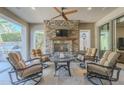 Relaxing covered patio with fireplace and comfortable seating at 1620 E Azafran Trl, Queen Creek, AZ 85140